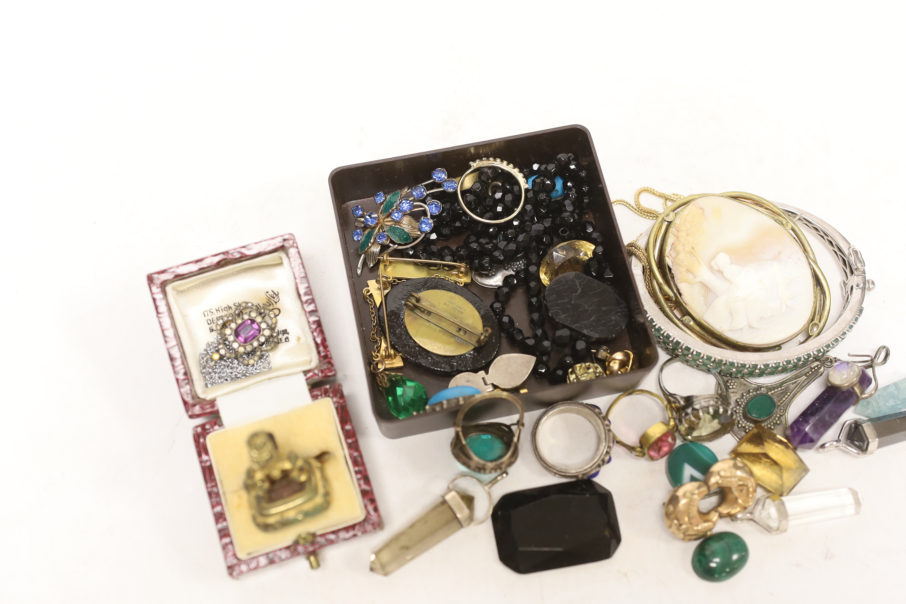 A small group of assorted costume jewellery including fob seal, pendants, rings, etc.